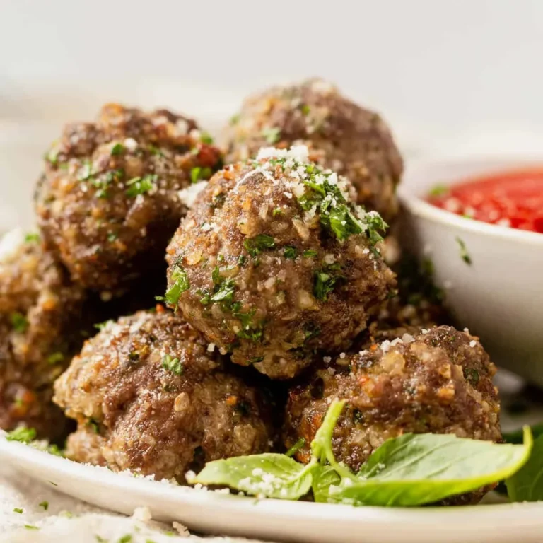 mixing breadcrumb and milk panade for air fryer meatballs in a glass bowl