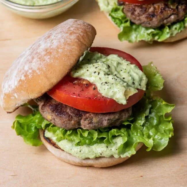 raw avocado burger patties with ground beef and mashed avocado mixed in
