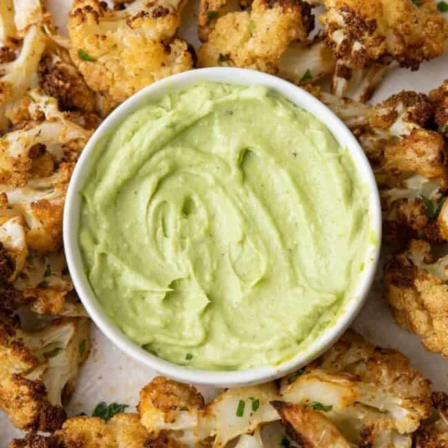 creamy green avocado hummus with pita bread