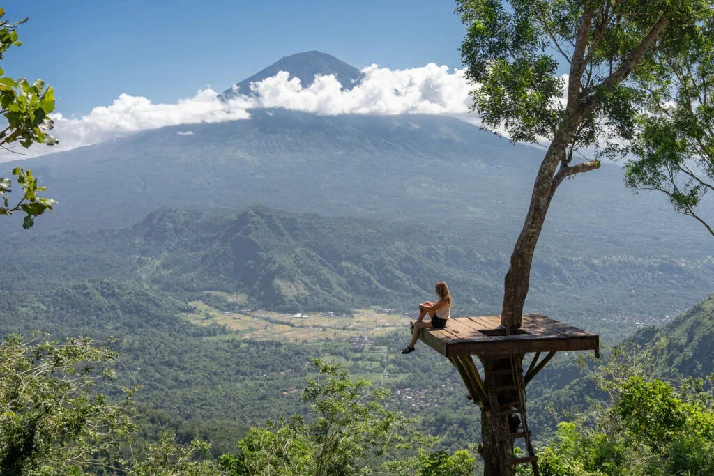 Outdoor yoga class in Ubud Bali surrounded by tropical greenery