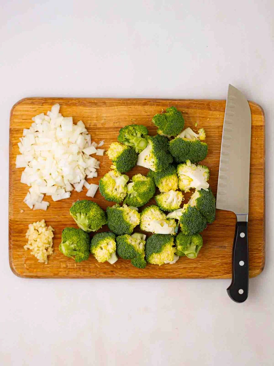Chopped onion and potatoes for broccoli and stilton soup preparation