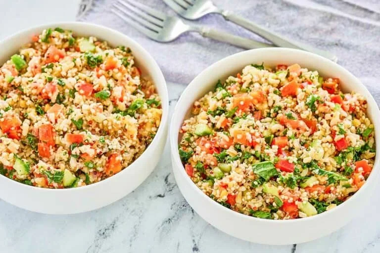 17 Spring Brunch Salads That Feel Fresh 5 vibrant quinoa salad with colorful vegetables and fresh herbs in a white bowl