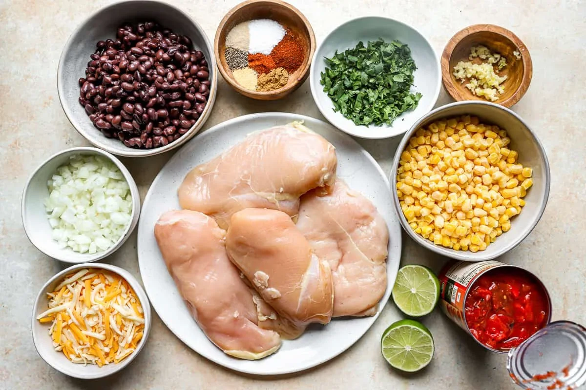 organized ingredients for cowboy chicken recipe including spices, chicken, and vegetables