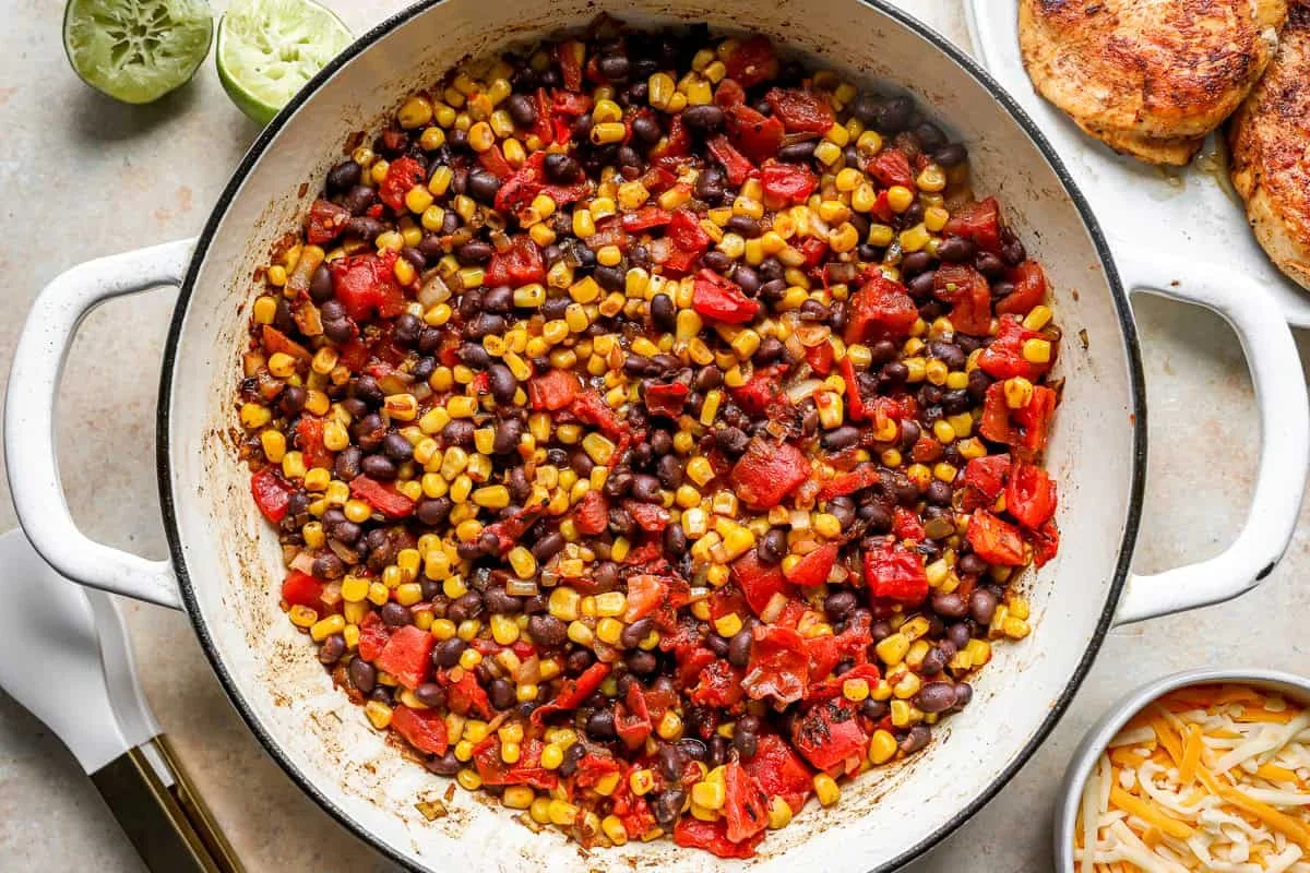sautéed onions, garlic, beans, corn, and tomatoes for cowboy chicken