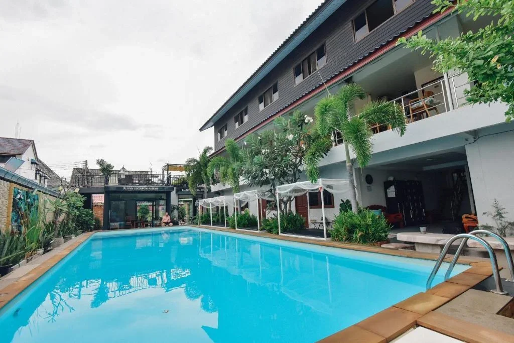 Spacious family room with two double beds at P.U. Inn Resort