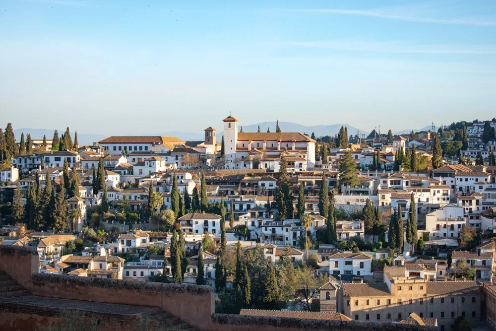 ancient Moorish bathhouse in Granada with star-shaped ceiling vents and stone arches