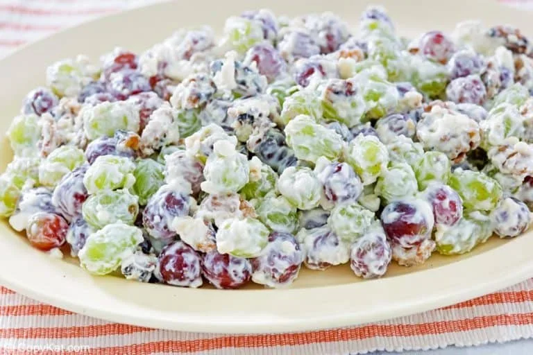 17 Spring Brunch Salads That Feel Fresh 13 creamy grape salad with toasted walnuts in a white bowl