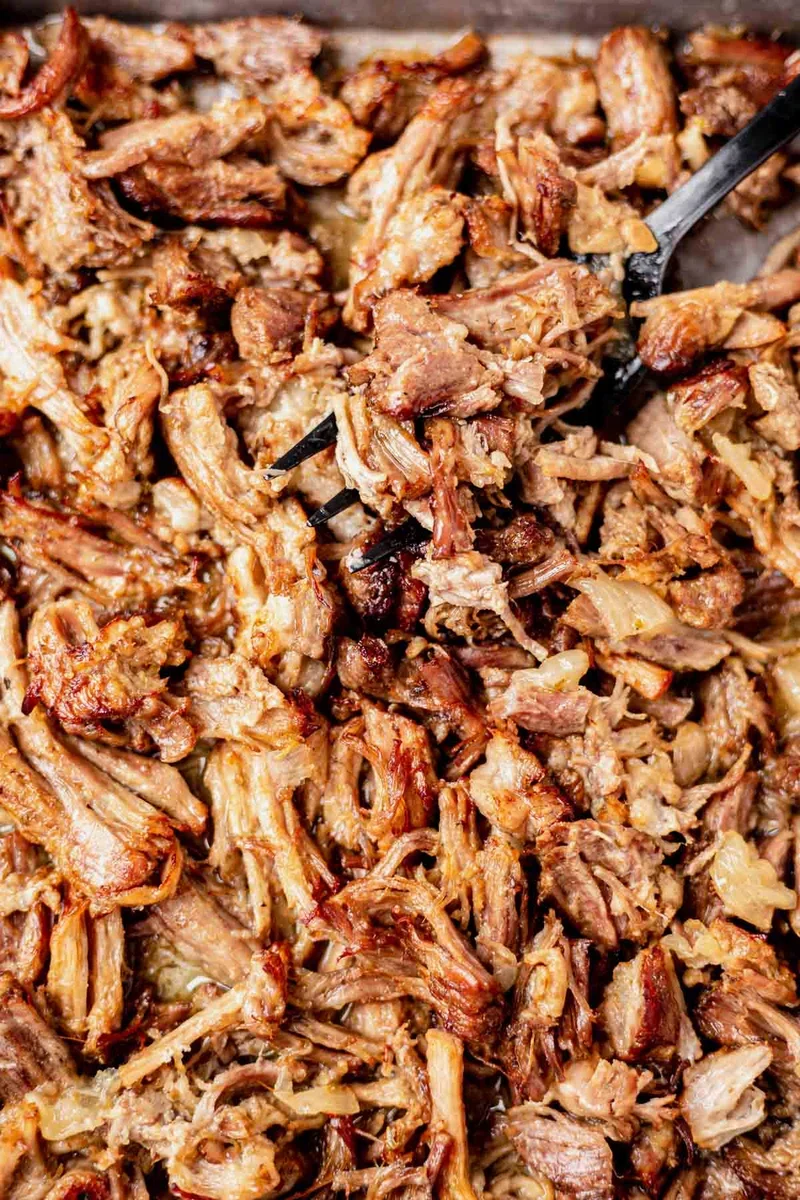 vibrant carnitas seasoning blend with cumin and paprika in a small bowl