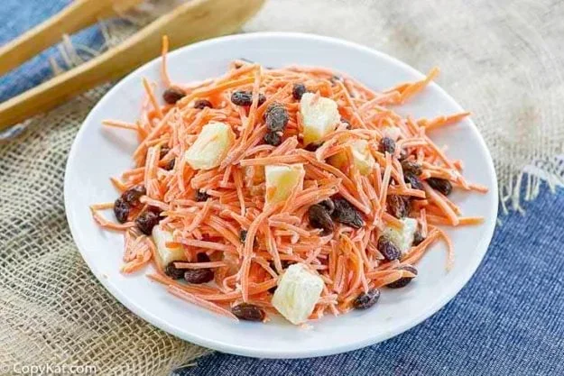 17 Spring Brunch Salads That Feel Fresh 10 Luby's shredded carrot salad with carrots, pineapple and creamy dressing in serving bowl
