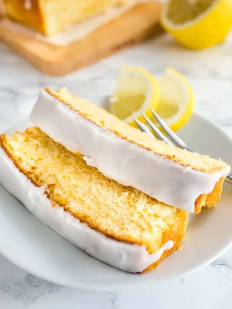 Perfectly released lemon bundt cake with thick glaze on a cooling rack