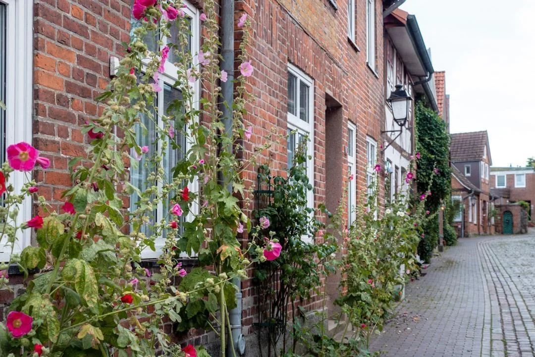 quiet cobblestone lane in Plön's historic old town with traditional buildings