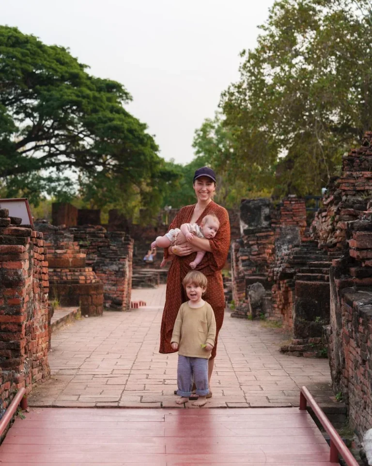 Sala Ayutthaya luxury hotel with pool and view of Wat Phutthaisawan at sunset