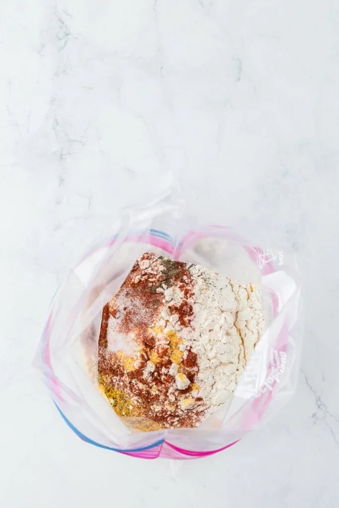 Authentic Mississippi Fried Catfish Recipe That's Crispy & Tender 2 dry cornmeal and spice mixture in an open zip-top bag