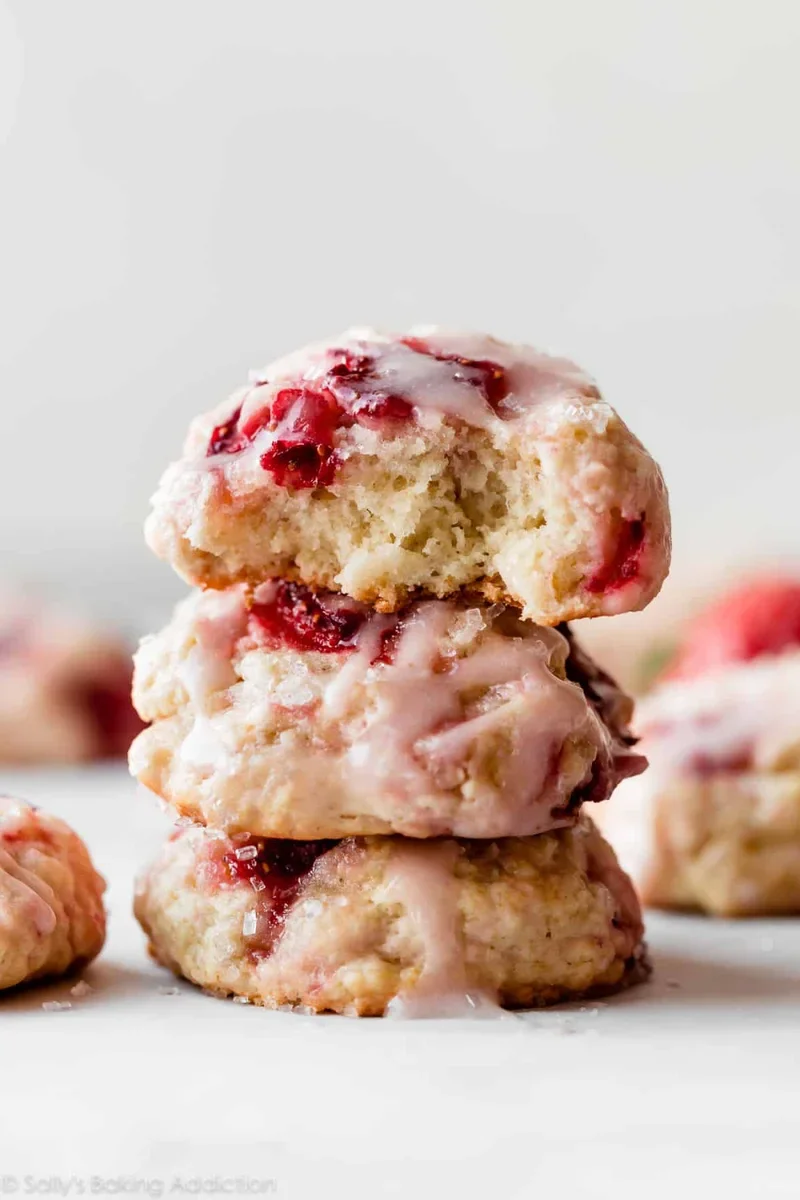 strawberry biscuit cookies drizzled with pink strawberry icing