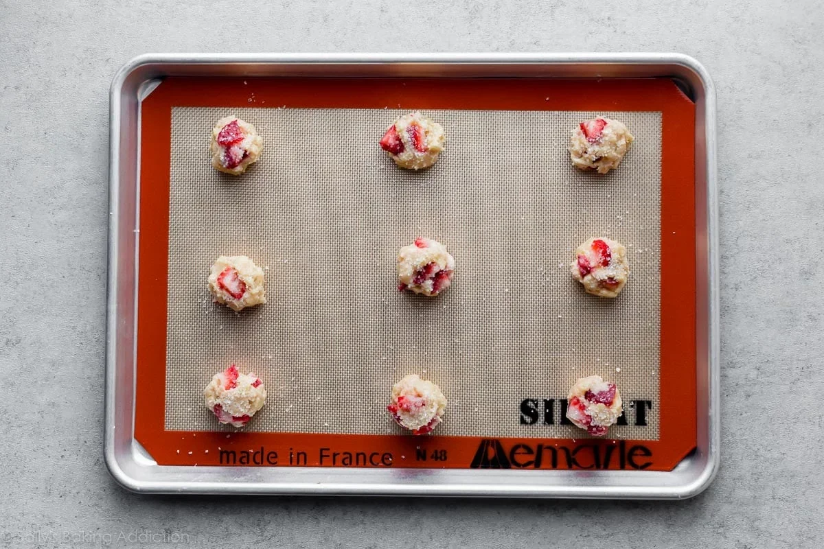 portioning strawberry biscuit cookie dough with cookie scoop
