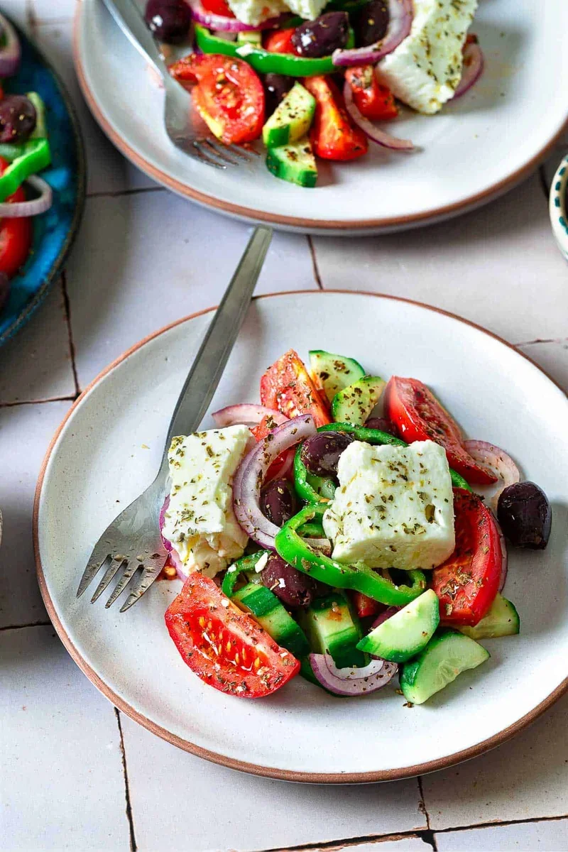 Authentic Greek Salad Recipe That's Easy and Delicious 2 fresh ingredients for traditional greek salad including tomatoes, cucumber, feta, and kalamata olives