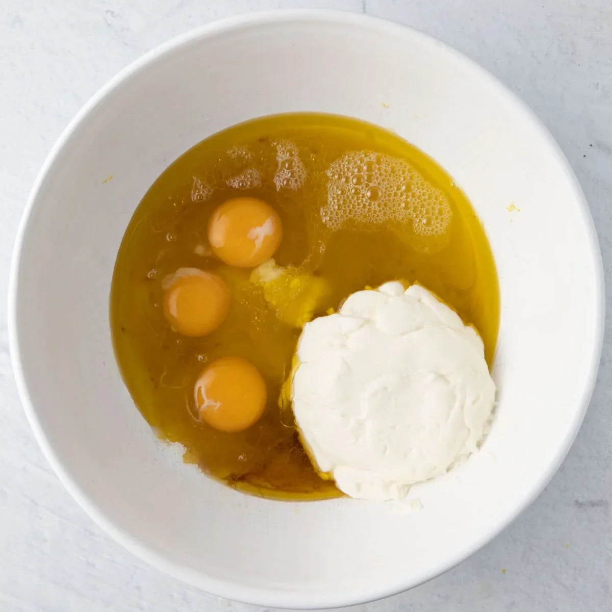 Easy Lemon Ricotta Cake Recipe with One-Bowl Simplicity 3 lemon ricotta cake made with fresh lemon zest, ricotta cheese and olive oil for a soft, moist texture. This one-bowl recipe requires no frosting and is perfect for spring. Try it tonight!