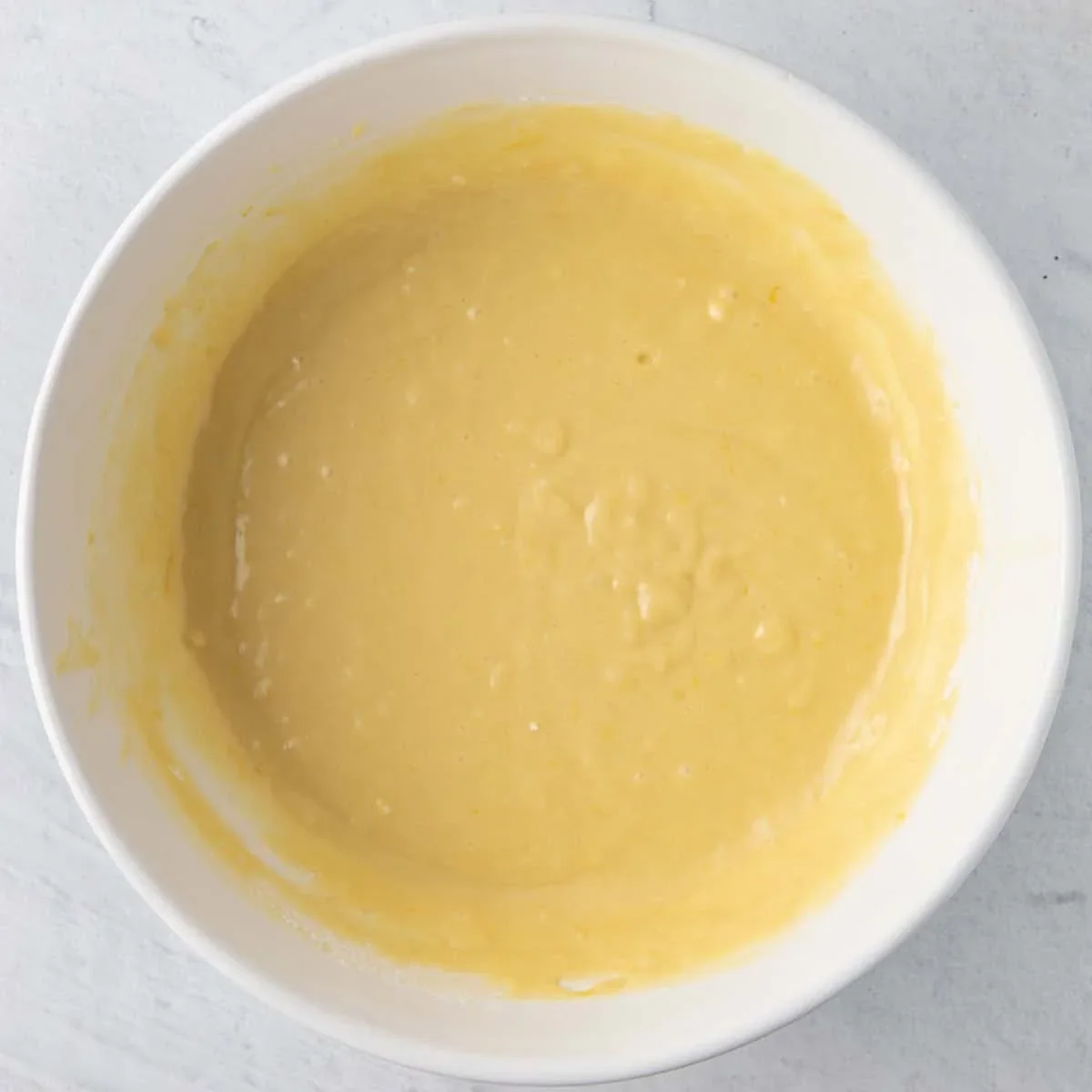 Easy Lemon Ricotta Cake Recipe with One-Bowl Simplicity 5 lemon ricotta cake made with fresh lemon zest, ricotta cheese and olive oil for a soft, moist texture. This one-bowl recipe requires no frosting and is perfect for spring. Try it tonight!