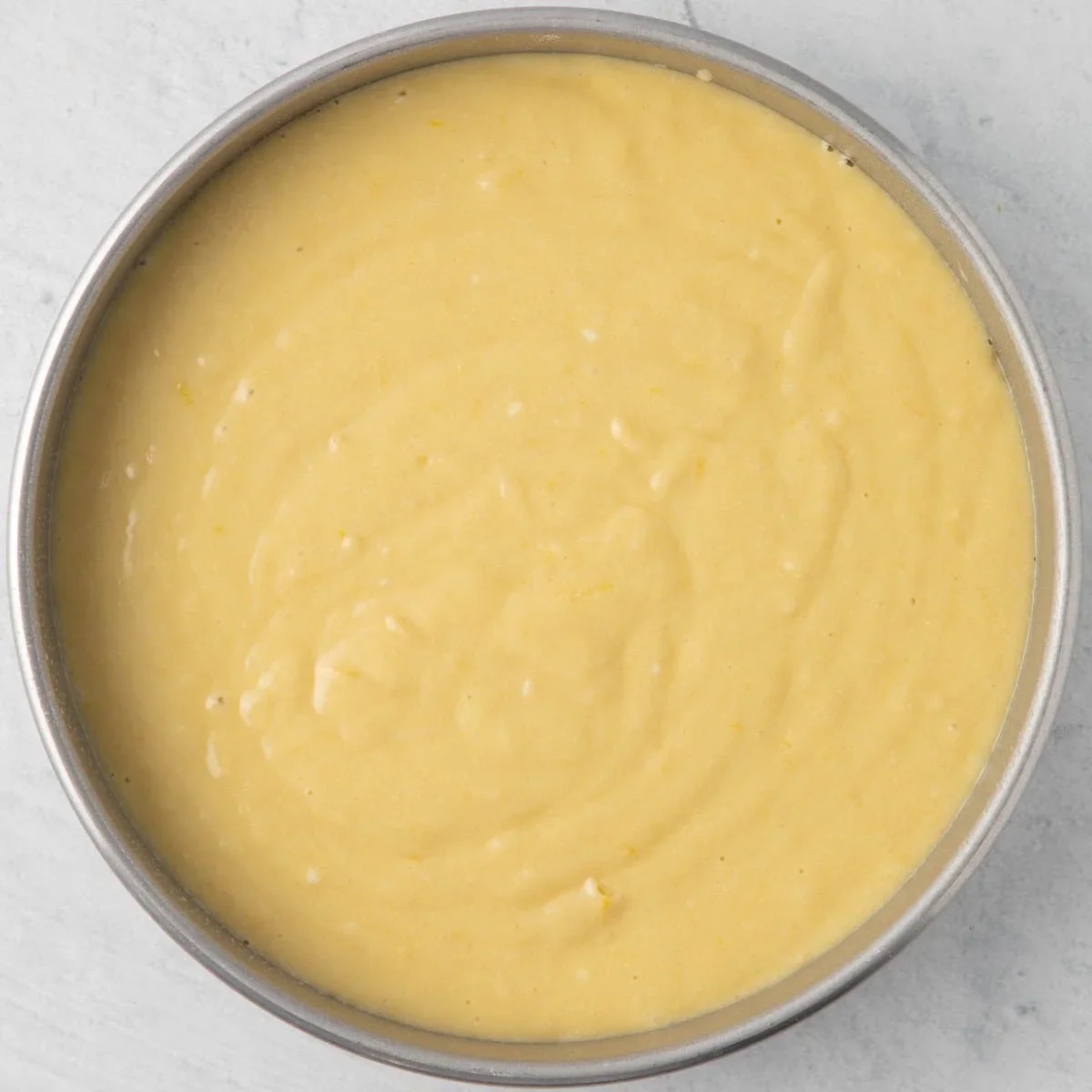 Easy Lemon Ricotta Cake Recipe with One-Bowl Simplicity 6 lemon ricotta cake made with fresh lemon zest, ricotta cheese and olive oil for a soft, moist texture. This one-bowl recipe requires no frosting and is perfect for spring. Try it tonight!