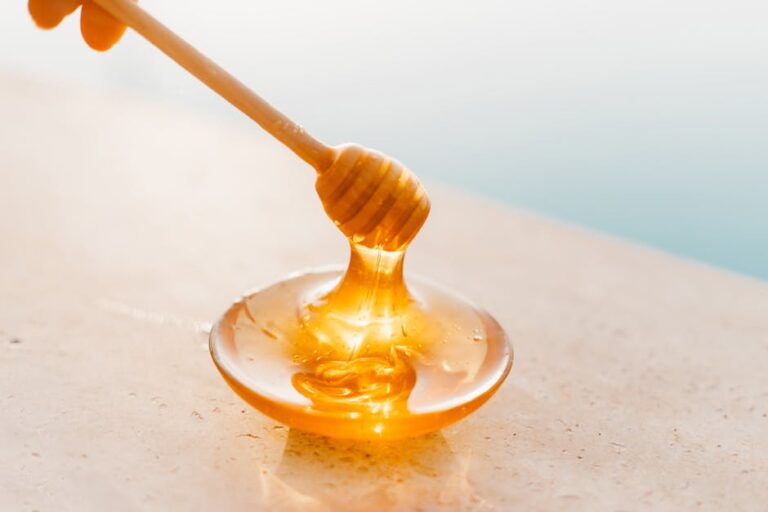 close-up of raw honey drizzling into a mug, honey trick recipe