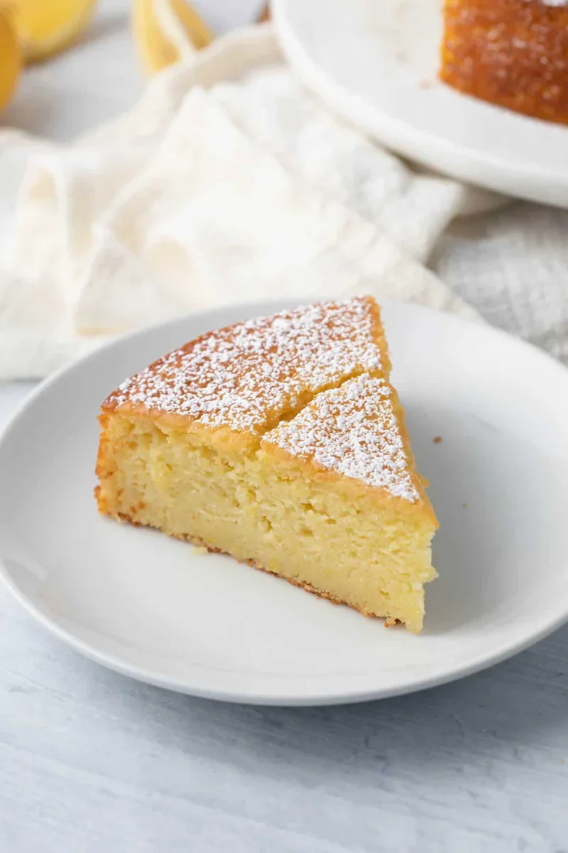 Easy Lemon Ricotta Cake Recipe with One-Bowl Simplicity 8 lemon ricotta cake batter being folded with a spatula, showing thick, smooth texture