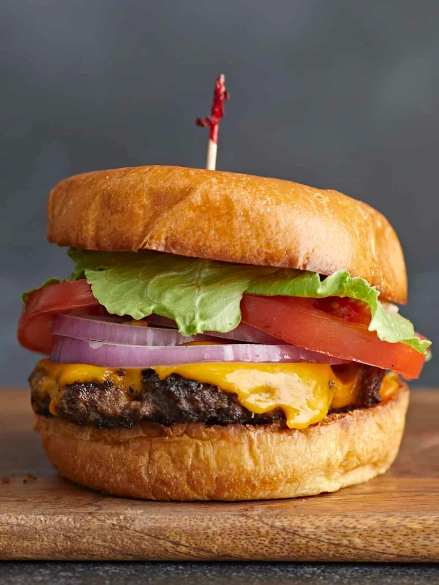 crispy smash burger patty with melted cheese in a cast iron skillet